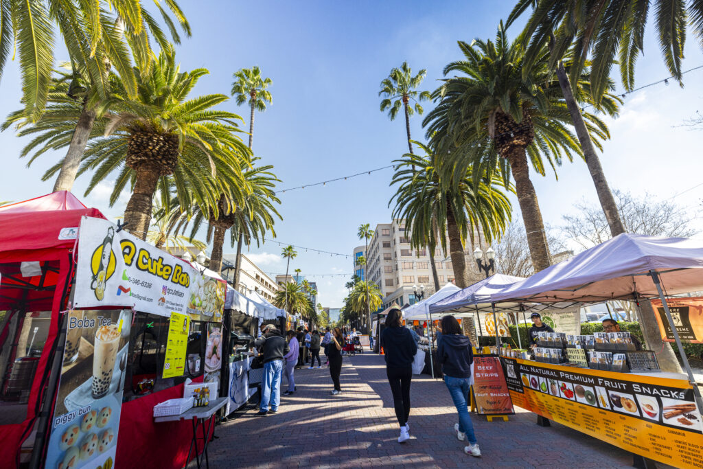 Farmers Market Booths on Center Street Promenade with palm trees along the sides